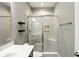 Close up of bathroom shower showcasing tile and storage; single sink at 14474 Treasure Creek Ln, Fishers, IN 46038