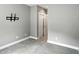 Bright bedroom featuring gray walls, plush carpet, and a spacious closet at 14474 Treasure Creek Ln, Fishers, IN 46038