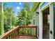 Inviting wooden deck with scenic view of lush, green trees at 14474 Treasure Creek Ln, Fishers, IN 46038