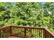 Relax on this wooden deck overlooking lush green trees and enjoy the beauty of nature at 14474 Treasure Creek Ln, Fishers, IN 46038