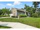 Well-maintained home with manicured hedges, lush green lawn, and inviting curb appeal at 14474 Treasure Creek Ln, Fishers, IN 46038