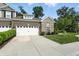 Attractive brick and stone home with a well-maintained lawn and spacious driveway at 14474 Treasure Creek Ln, Fishers, IN 46038
