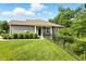 Charming home with a well-kept lawn, manicured bushes, and wrought-iron fence at 14474 Treasure Creek Ln, Fishers, IN 46038