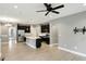 Modern kitchen features stainless steel appliances and a center island with a sink at 14474 Treasure Creek Ln, Fishers, IN 46038