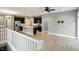 Open concept living area featuring kitchen with island, stainless steel appliances, and wood flooring at 14474 Treasure Creek Ln, Fishers, IN 46038