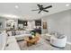Open-concept living room boasts abundant natural light and a seamless flow into the modern kitchen at 14474 Treasure Creek Ln, Fishers, IN 46038