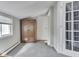 Attic room featuring carpet, an armoire, and windows for natural light at 1532 E Markwood Ave, Indianapolis, IN 46227