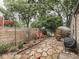 Backyard featuring a stone patio and wood fence, providing privacy and a cozy ambiance at 1532 E Markwood Ave, Indianapolis, IN 46227