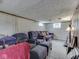 Relaxing basement area with cozy seating, perfect for entertainment or a quiet retreat at 1532 E Markwood Ave, Indianapolis, IN 46227