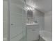 Modern bathroom featuring a shower, vanity with storage, and a tub for a luxurious experience at 1532 E Markwood Ave, Indianapolis, IN 46227