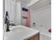 Bright bathroom featuring a vanity, sink, shower, and updated fixtures at 1532 E Markwood Ave, Indianapolis, IN 46227