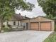 Home exterior with a two-car garage and hot tub, adding practicality and luxury at 1532 E Markwood Ave, Indianapolis, IN 46227