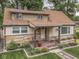 Beautiful house with stone details, inviting porch, and a well-kept landscaped front yard at 1532 E Markwood Ave, Indianapolis, IN 46227