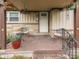 Inviting front porch with seating, decorative plants, and stone accents at 1532 E Markwood Ave, Indianapolis, IN 46227
