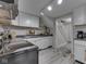 Functional kitchen features modern appliances and a staircase to the second floor at 1532 E Markwood Ave, Indianapolis, IN 46227