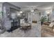 Open-concept living room with a stone fireplace, built-in shelves, and comfortable seating at 1532 E Markwood Ave, Indianapolis, IN 46227