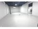 A spacious unfinished basement area with white-painted walls, providing ample storage or potential living space at 1556 N Euclid Ave, Indianapolis, IN 46201