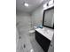 Bathroom featuring a vanity with modern fixtures, a framed mirror, and a bath and shower combo at 1556 N Euclid Ave, Indianapolis, IN 46201