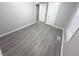 This bedroom features modern flooring and fresh paint for a clean and updated look at 1556 N Euclid Ave, Indianapolis, IN 46201