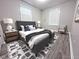 Cozy bedroom with stylish gray finishes and well placed decor at 1556 N Euclid Ave, Indianapolis, IN 46201