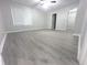 Bright bedroom with large window, new flooring, and closet space at 1556 N Euclid Ave, Indianapolis, IN 46201