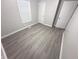 Cozy bedroom with new floors, closet and window providing natural light at 1556 N Euclid Ave, Indianapolis, IN 46201