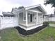 Charming single-story home featuring a covered front porch and vinyl siding at 1556 N Euclid Ave, Indianapolis, IN 46201
