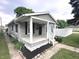 Charming single-story home featuring a covered front porch and vinyl siding at 1556 N Euclid Ave, Indianapolis, IN 46201