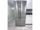 Stainless steel refrigerator with water dispenser blends seamlessly with white kitchen cabinetry at 1556 N Euclid Ave, Indianapolis, IN 46201