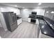 Modern kitchen featuring stainless steel appliances, sleek countertops, and ample cabinet space at 1556 N Euclid Ave, Indianapolis, IN 46201