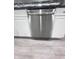 Stainless steel dishwasher integrated into white cabinetry, complementing the modern kitchen design at 1556 N Euclid Ave, Indianapolis, IN 46201