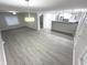 Spacious living room with modern flooring and open layout to the eat-in kitchen at 1556 N Euclid Ave, Indianapolis, IN 46201