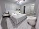 Relaxing primary bedroom with a comfortable bed and minimalist decor at 1556 N Euclid Ave, Indianapolis, IN 46201
