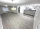 Open concept layout showcasing the living area and kitchen with hardwood floors at 1556 N Euclid Ave, Indianapolis, IN 46201