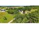 Expansive aerial view of the property showcasing lush greenery, outbuildings, and a serene setting at 17138 Joliet Rd, Westfield, IN 46074