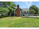 Exterior of home with a spacious backyard, featuring a large deck with ample seating and lush lawn at 17138 Joliet Rd, Westfield, IN 46074