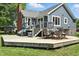 Backyard deck perfect for outdoor relaxation and entertaining, with stylish furniture and landscaping at 17138 Joliet Rd, Westfield, IN 46074
