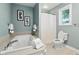 Serene bathroom featuring a soaking tub, shower with glass door, and white fixtures and spa aesthetic at 17138 Joliet Rd, Westfield, IN 46074