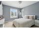 Bright bedroom with a large window, stylish decor, neutral tones, and plush bedding at 17138 Joliet Rd, Westfield, IN 46074