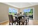A dining room with wood table and windows offering great outdoor views and natural light at 17138 Joliet Rd, Westfield, IN 46074