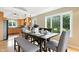 Bright dining room features a wood table with seating, hardwood floors and a large window at 17138 Joliet Rd, Westfield, IN 46074