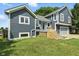 View of the home's exterior with gray siding, white trim and a blue door at 17138 Joliet Rd, Westfield, IN 46074