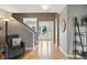 Spacious foyer with hardwood floors, staircase, and views of the front yard through the glass front door at 17138 Joliet Rd, Westfield, IN 46074