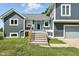 Charming gray two-story home with a blue front door and wooden steps at 17138 Joliet Rd, Westfield, IN 46074