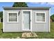 Exterior view of a storage shed with a glass paneled door and windows, great for storage at 17138 Joliet Rd, Westfield, IN 46074