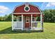 Exterior view of a shed with a small porch and swing, perfect for relaxing outdoors at 17138 Joliet Rd, Westfield, IN 46074