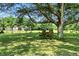 Image shows a rustic tree swing in the yard of the property with manicured grass and large shade trees at 17138 Joliet Rd, Westfield, IN 46074