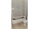 Bathroom featuring modern white tile and bathtub with shower at 2157 Sugar Grove Ave, Indianapolis, IN 46202