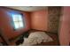 Bedroom with original hardwood floors and wallpaper in need of renovation at 2157 Sugar Grove Ave, Indianapolis, IN 46202