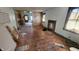 Spacious living room featuring hardwood floors, large windows, and natural light at 2157 Sugar Grove Ave, Indianapolis, IN 46202